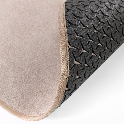 Pyöreä, beige eteisen matto, jossa näkyy eristettyä ja hengittävä pohjakuviointi.