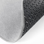 Pyöreä, vaaleanharmaa eteisen matto, jossa näkyy eristettyä ja hengittävä pohjakuviointi.