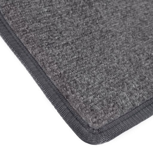 Keskiharmaa ovimatto kantatuilla reunoilla.